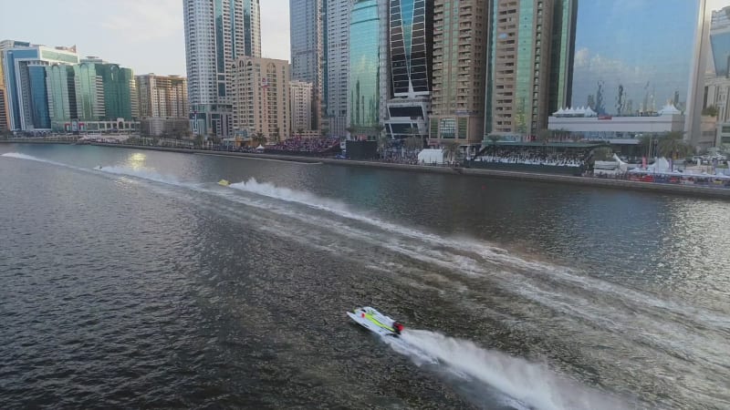 Aerial view audience looking speed boats race in Khalid lake.