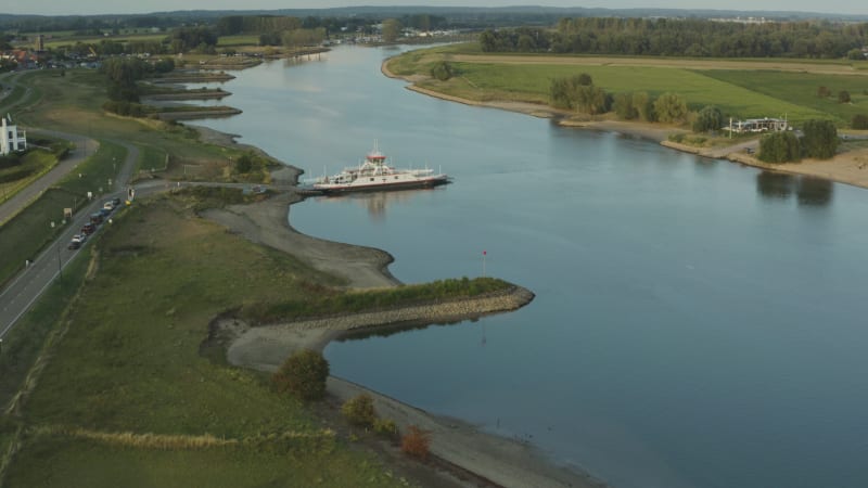 Aerial View of River in Wijk bij Duurstede with Docked Boat and Surrounding Fields