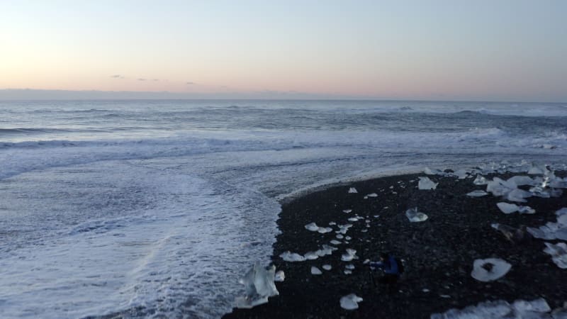 Flying over Diamond Beach,  Black Beach in Iceland in Winter Snow, Ice, Waves, Water