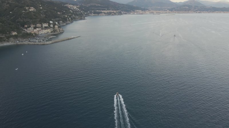 Aerial view of motorboats sailing along the Amalfi coast, Salerno, Italy.