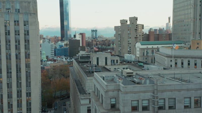 Forwards fly above city development. Modern downtown skyscrapers in background. Manhattan, New York City, USA