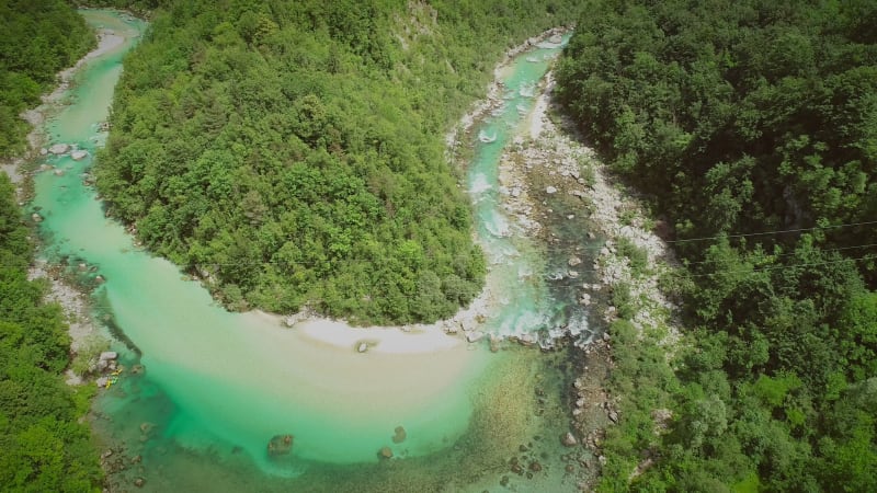 Aerial view of the calm water surrounded by nature.