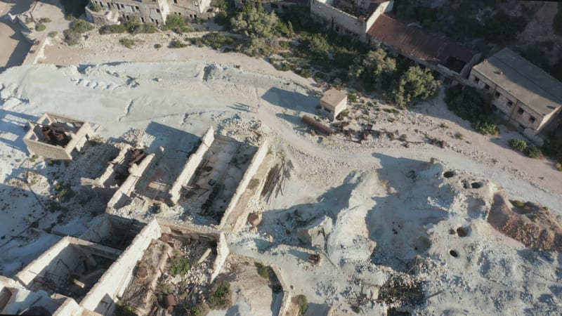 Aerial View of an Abandoned Factory Village at Beach on Milos Island, Greece at Sunset