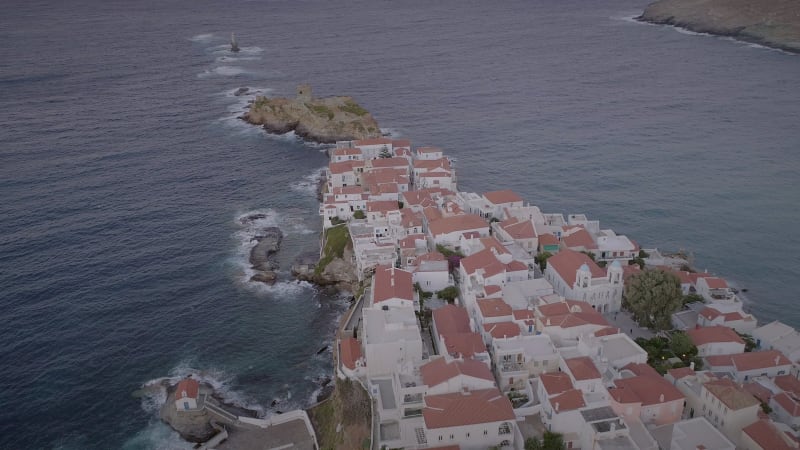 Aerial view of people raises windsurfing sail in the sea.