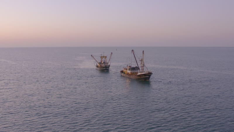 Fishing Trawlers at Sea in the Early Morning Aerial View