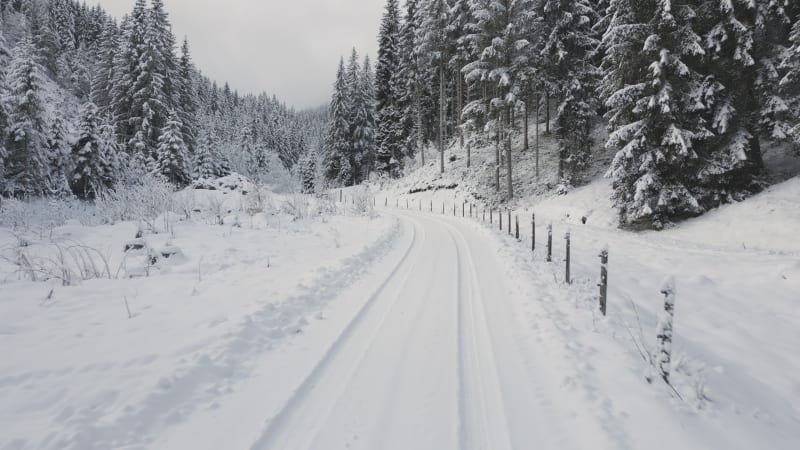 Snow-Covered Mountain Road Journey in Flachau, Austria