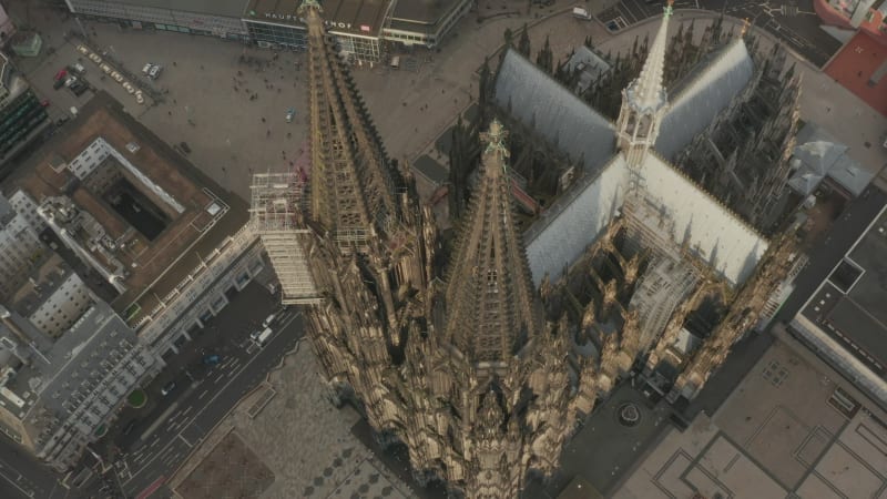 High angle view of gothic cathedral in city. Amazing ascending shot of historic landmark and popular tourist destination. Cologne, Germany