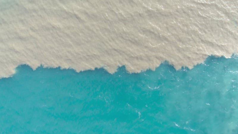 Aerial view of river and sea waters mixing in Rio.