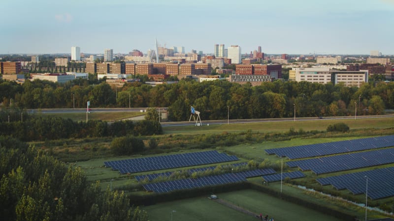 Solar panels and a highway next to the downtown office buildings.