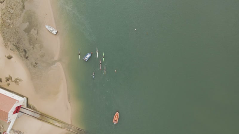 Aerial view of people doing kayak along Mira River, Portugal.