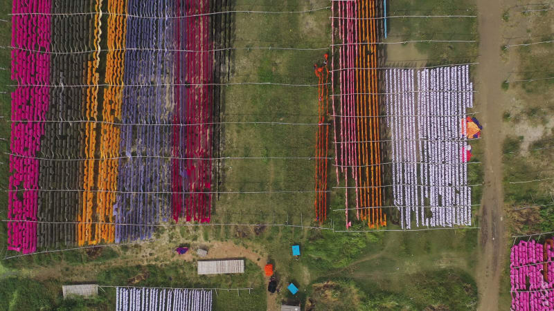 Aerial view of colourful fabric hanged in Narayanganj, Bangladesh.