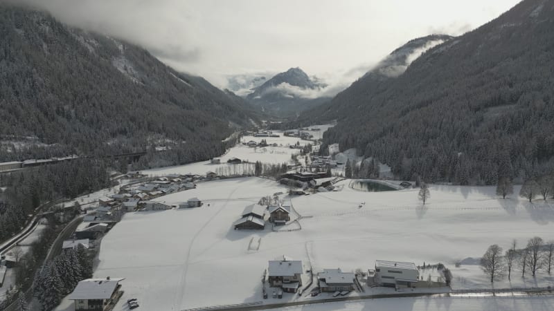 Winter Aerial View of Flachau Between Hills and Mountain