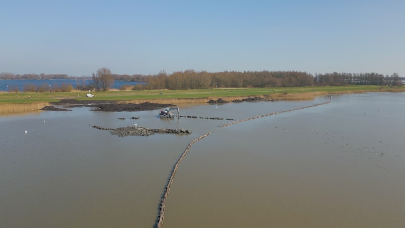 Excavator working in a lake