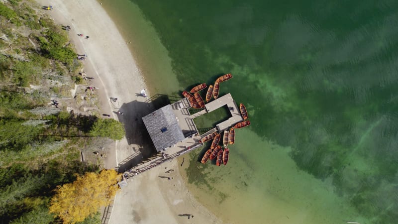 Aerial View of Emerald lake and boathouse in Lake Braies, Dolomites, Italy.