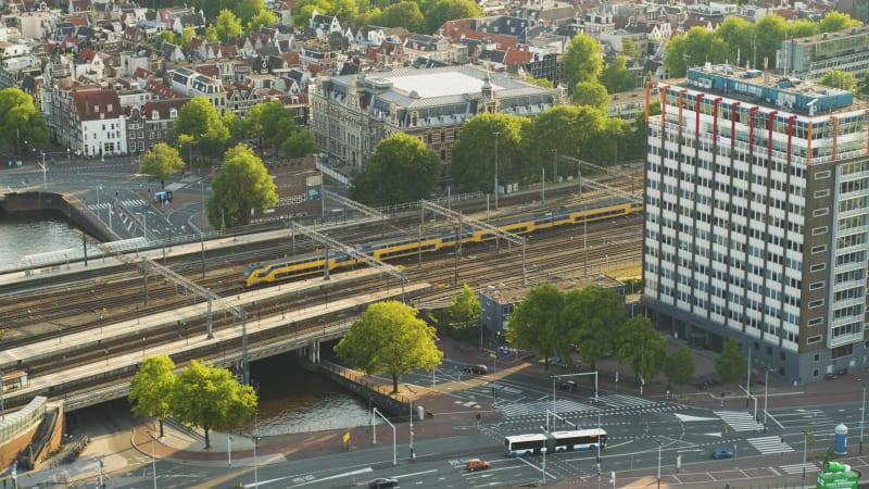 Aerial view of the trains leaving Amsterdam central station