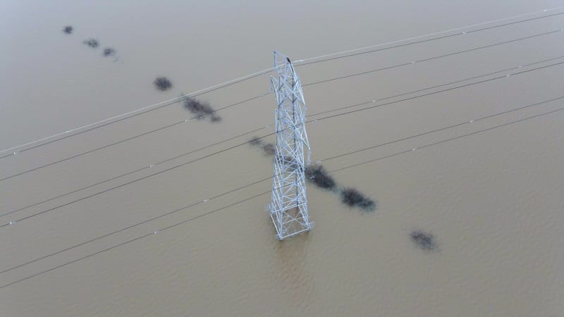 An Electricity Pylon in Deep Water in a Floodwaters Causing Power Cuts