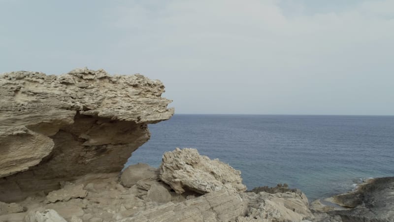 Aerial view of rock formation on the coast.