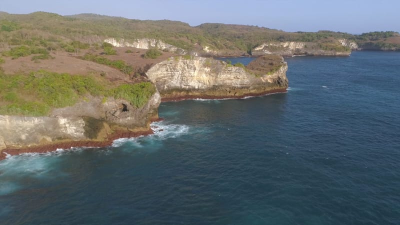 Aerial view of cliff formation on the coast of Bali island.