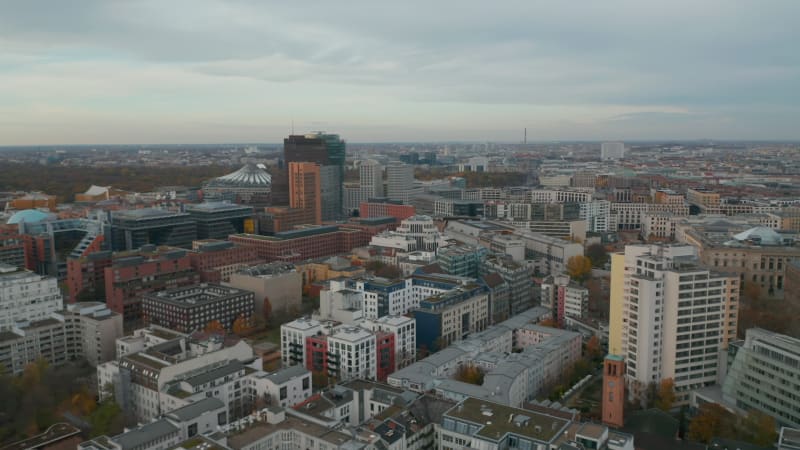 Aerial View of Office Buildings Skyscrapers in the City with Overcast Sky, Potsdamer Platz in Berlin Germany in Autumn, Drone Shot Dolly forward