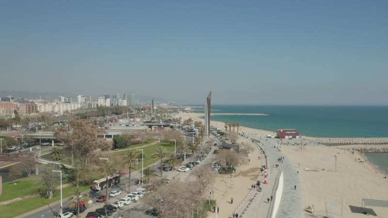 Drone Flight over Barcelona Beach on Beautiful Sunny Day with Blue Sky