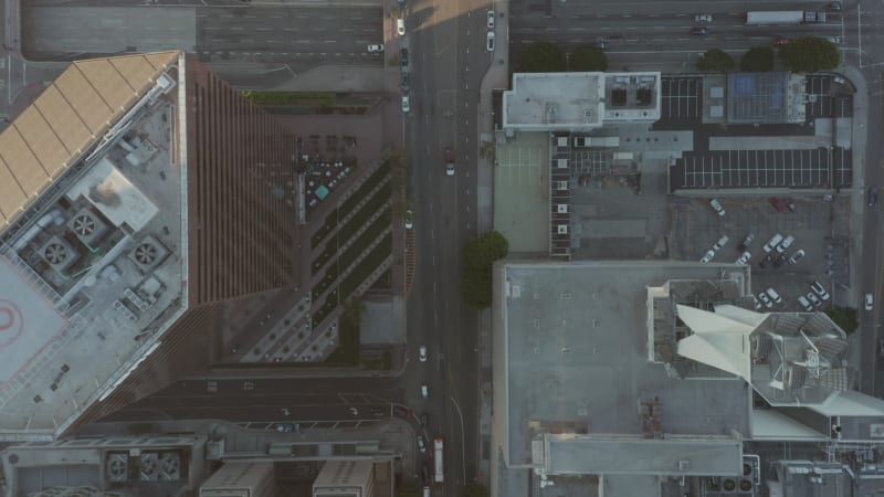 Street in a Big Metropolitan Downtown City Area with Helicopter Pads on Rooftops in Sunset light, Aerial Birds Eye Overhead Top Down View of Major City