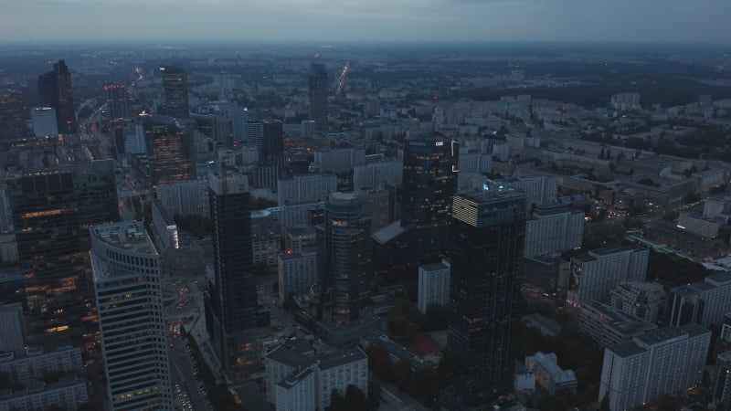 Aerial panoramic footage of downtown at twilight. High rise office buildings in city centre. Warsaw, Poland