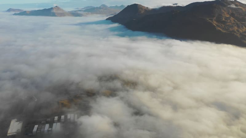 Aerial view of Unalaska Bay with fog on Unalaska island, Alaska, United States.