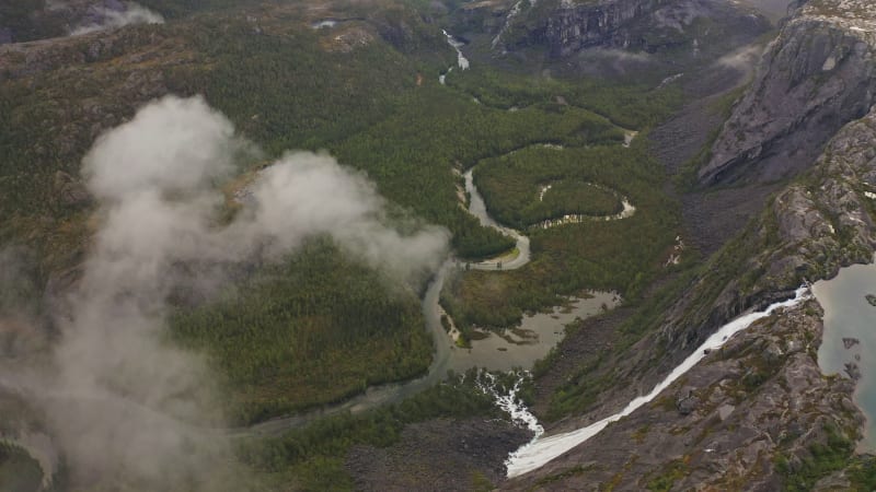 Soaring over verdant valleys, roaring waterfall, wilderness and rivers at Rago National Park, Norway.