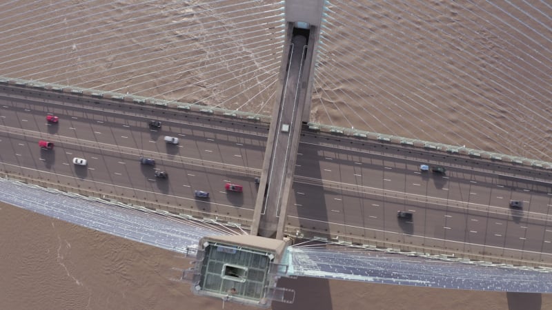 Cars and Lorries Driving Across a Cable Stayed Bridge Aerial View