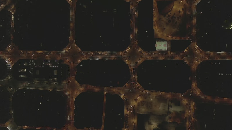 Barcelona Overhead Drone Shot of Typical City Blocks at Night with Beautiful City Traffic lights