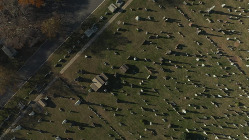 Aerial birds eye overhead top down view of rows of gravestones on historic Calvary Cemetery. Queens, New York City, USA