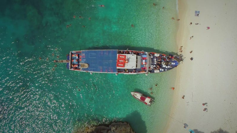 Aerial view above people disembarking off ferry, Ithaki.