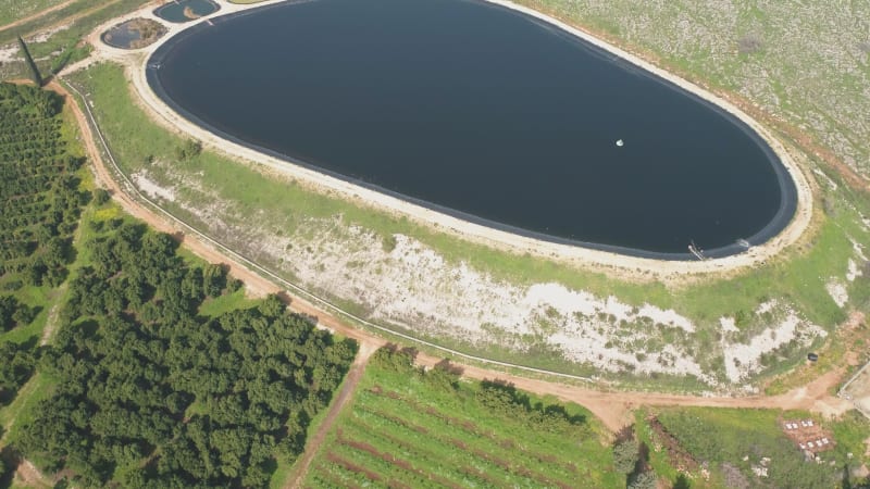 Aerial view of reservoir in a shape of a foot. Amiad, Northern district, Israel