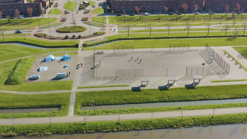 Kids and teenagers enjoying sports activities in an urban sports park