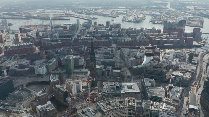 Aerial view of Hamburg city center with St. Nikolai Memorial church ruins among residential houses by the river