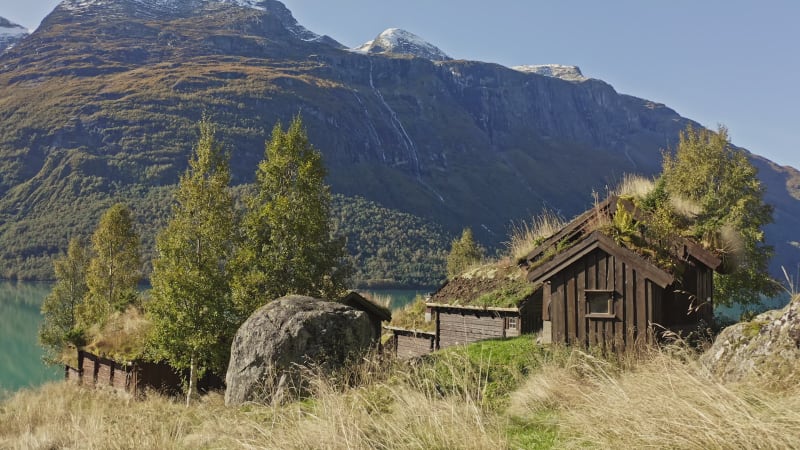 Farm houses on Breng Mountain along the Lovatnet river in Norway.