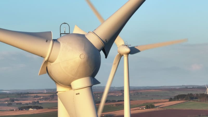 Wind Farm Turbines at Sunset Generating Renewable Power