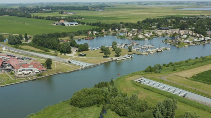 Pullback shot of underwater tunnel in small harbor village