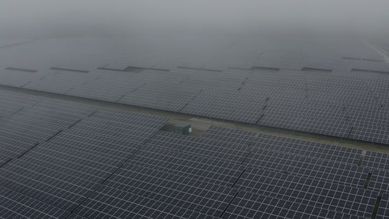 PV panels side shot fly up into the fog Almelo Netherlands