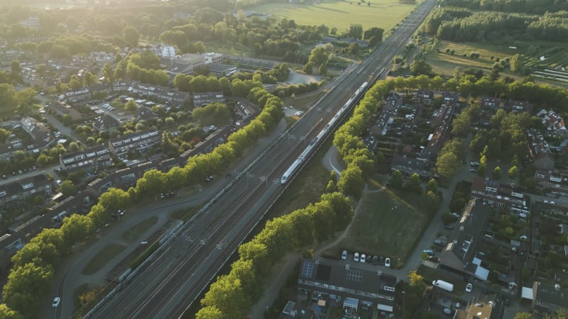 Overhead Perspective of  a high speed Train passing Residential Area of Houten, the Netherlands