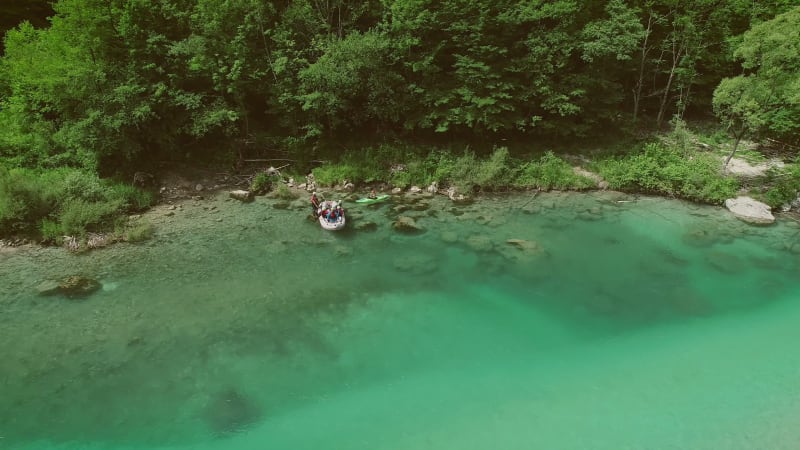 Aerial view of a group sitting in the boat preparing for rafting.