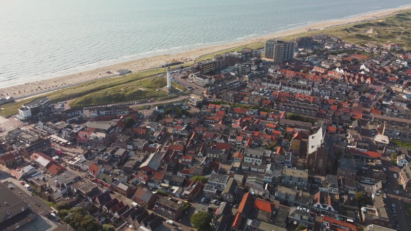 Parish of St. Agnes, houses and beach in Egmond Aan Zee, North Holland province, the Netherlands.