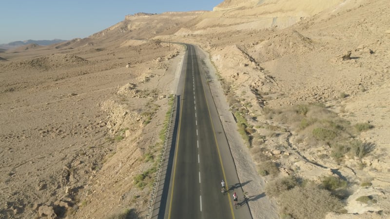 Aerial view of two person on bicycle, Mizpe Ramon, Israel.