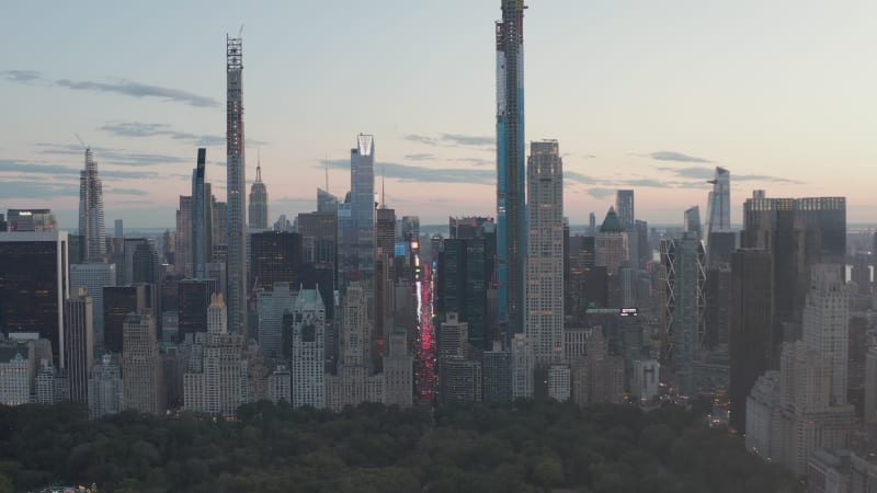 City at Night with Tall Buildings and flashing lights, Manhattan, New York City from beautiful Aerial perspective