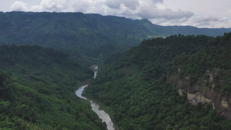 Aerial view of a river crossing the valley in Bandarban, Bangladesh.