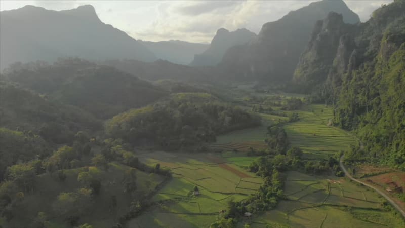 Aerial view of forests, hills, and rice fields