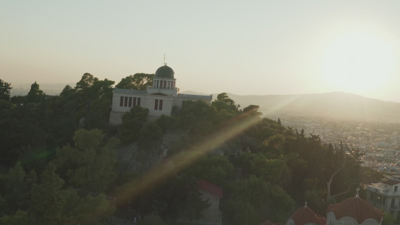 Aerial View of National Observatory of Athens on Hill during Golden Hour Sunset Light