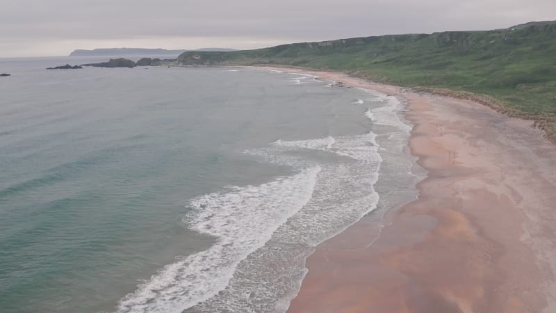 Stunning sandy beach, Antrim Coast of Northern Ireland. Aerial drone view