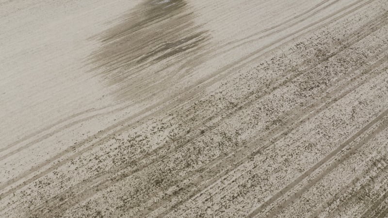 Rotating aerial view of the dry farm fields