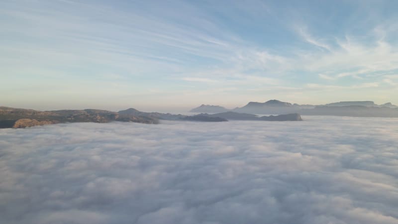 Aerial view of False bay covered in low cloud sunrise, Simonstown, Cape Town, South Africa.